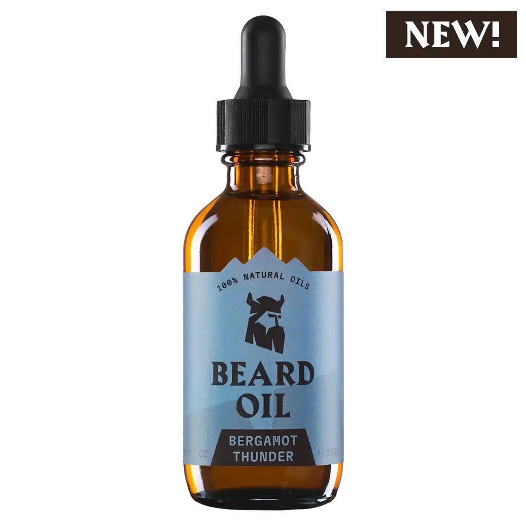 Bottle of beard oil with a dropper labeled 'Bergamot Thunder' on a white background.
