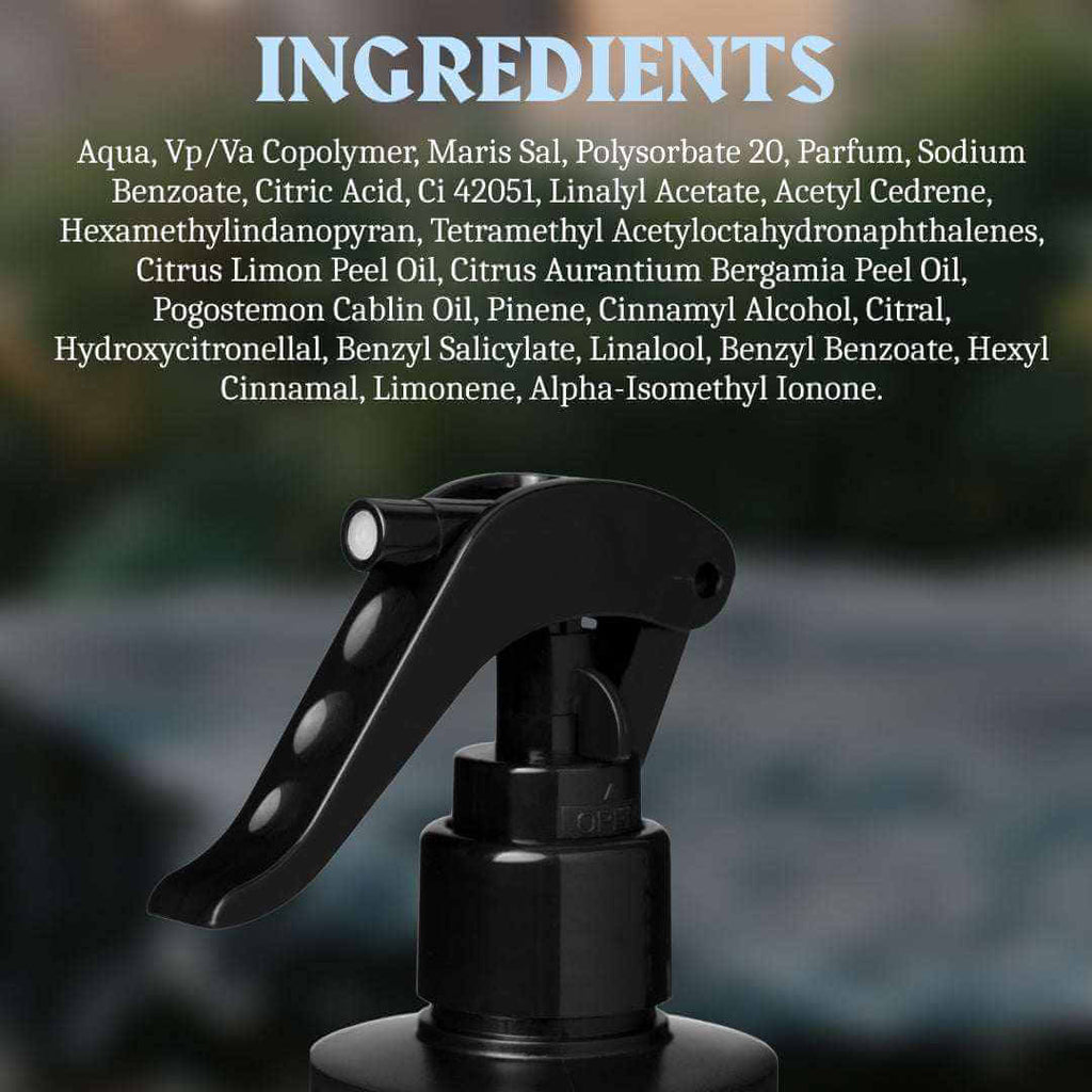 Black spray bottle with ingredients list on a blurred natural background