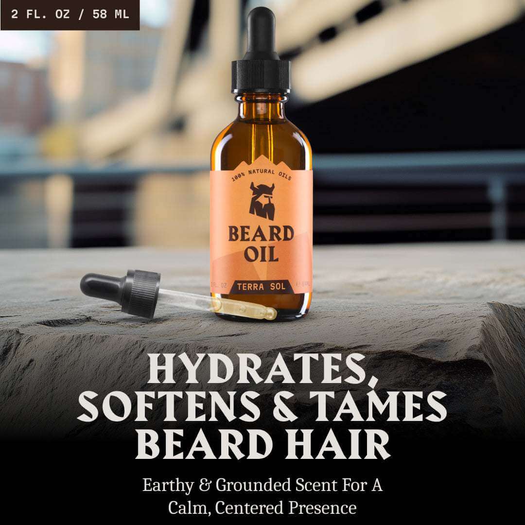 Beard oil bottle with dropper on a wooden surface, featuring Terra Sol branding.