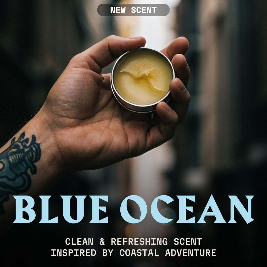 Hand holding a small container of wax with 'Blue Ocean