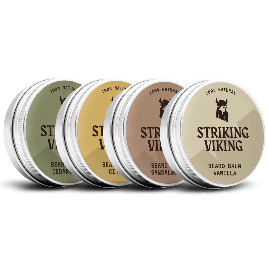 Four tins of Striking Viking beard balm on a white background