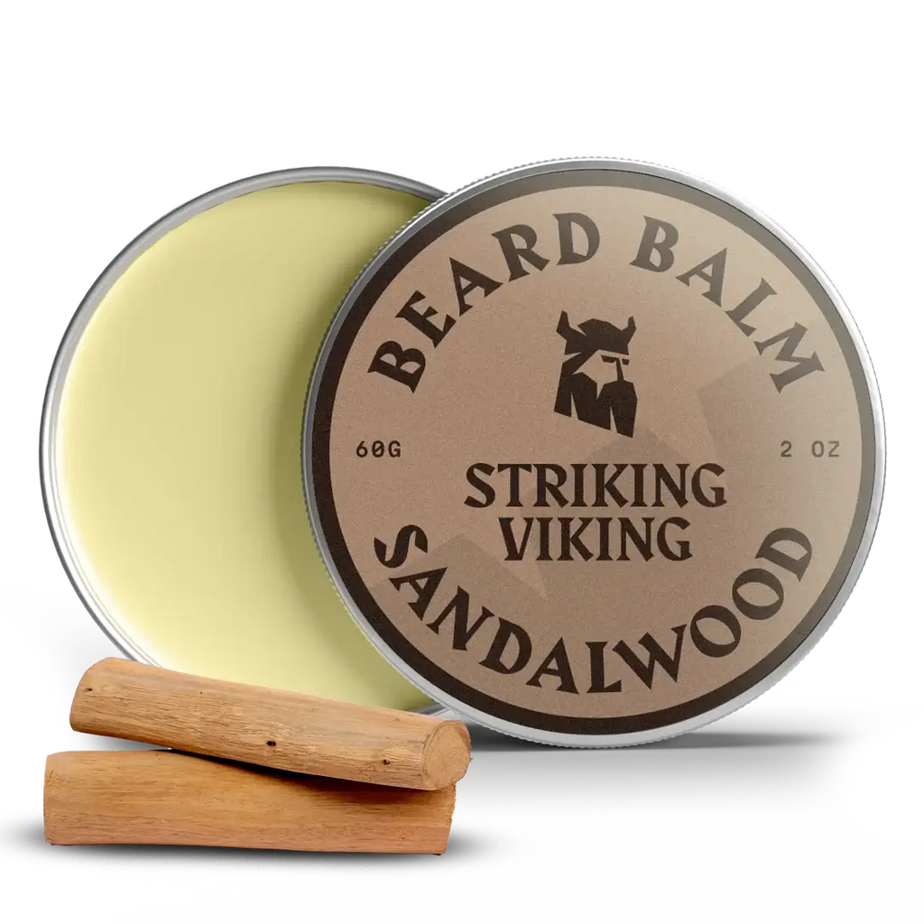 Beard balm container labeled 'Striking Viking Sandalwood' with a wooden applicator on a white background