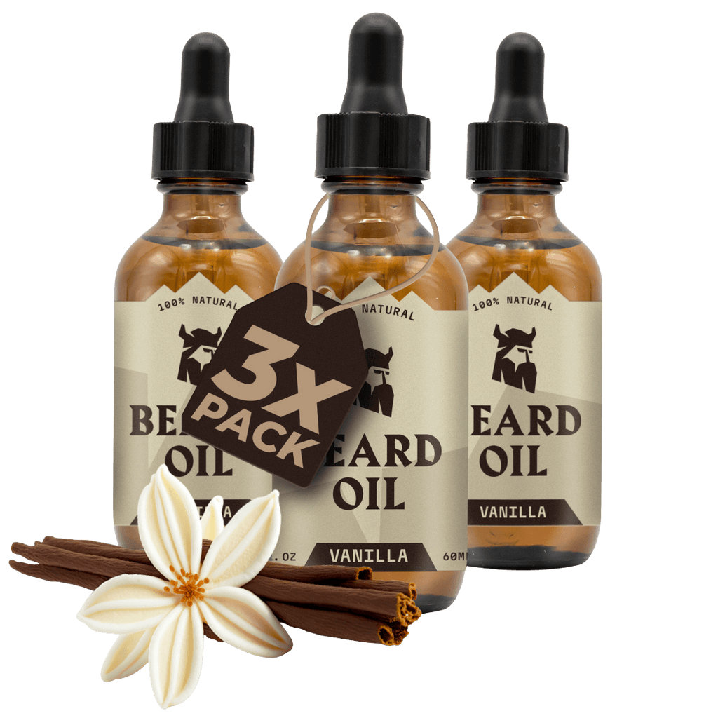 Three bottles of vanilla scented beard oil with droppers, surrounded by vanilla flowers