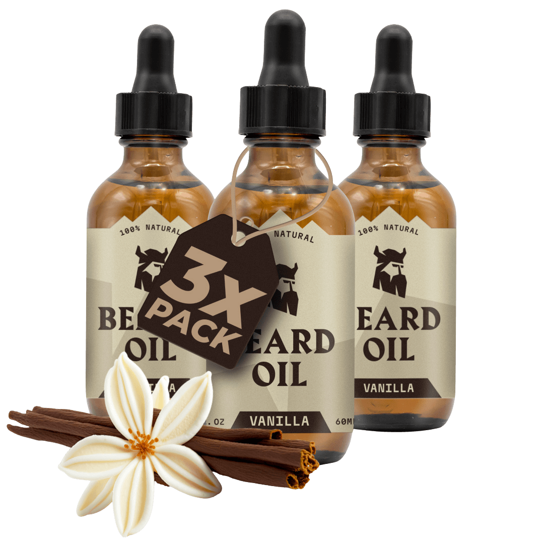 Three bottles of vanilla scented beard oil with droppers, surrounded by vanilla flowers