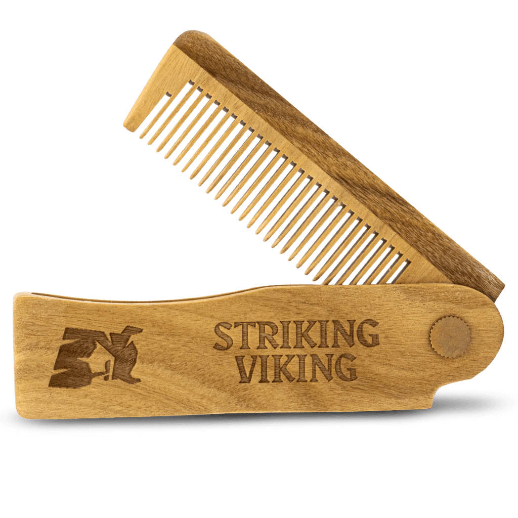 Wooden comb with 'Striking Viking' branding on a white background